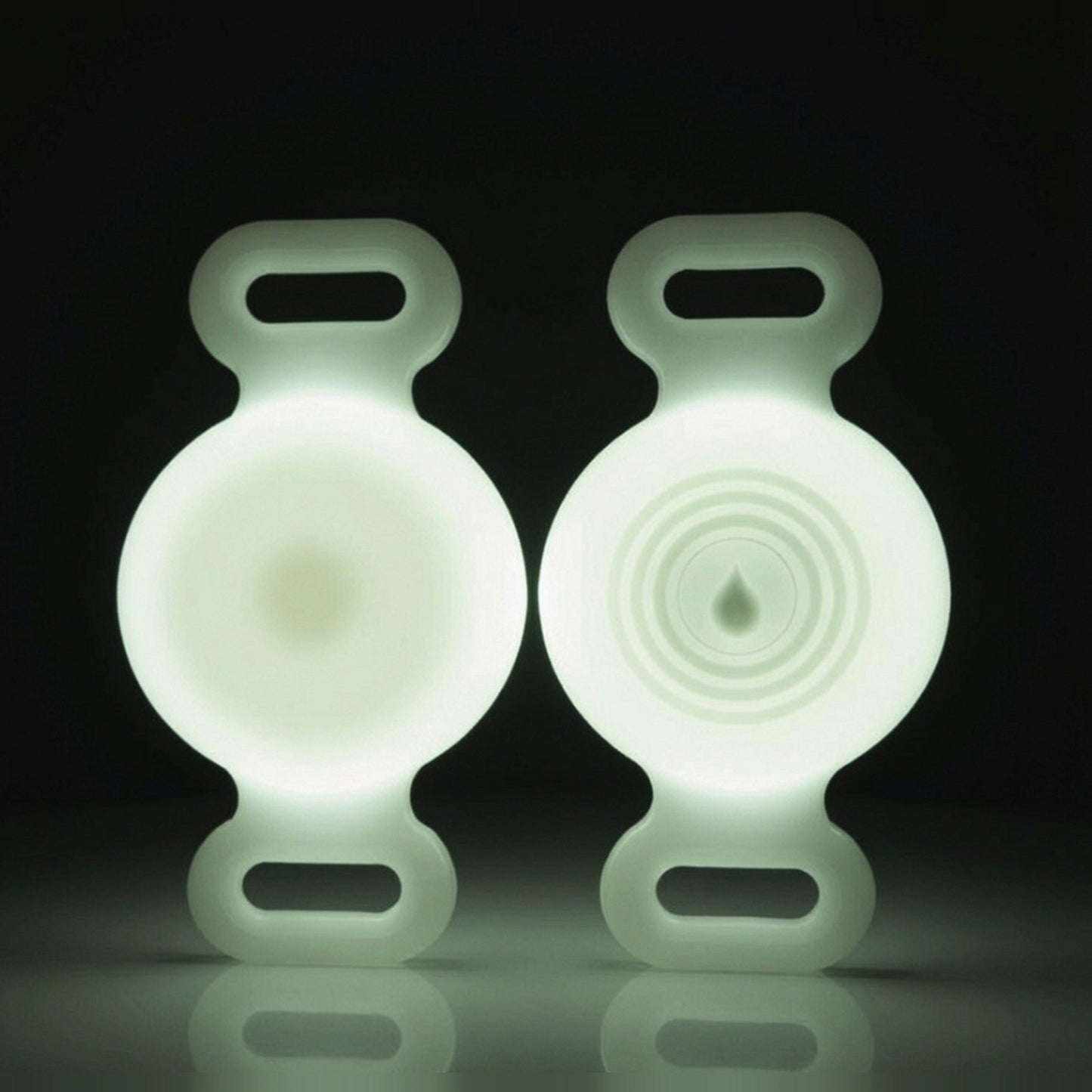 TailTrace dog collar tracker case — Glow White, front and back studio photo shown glowing in the dark