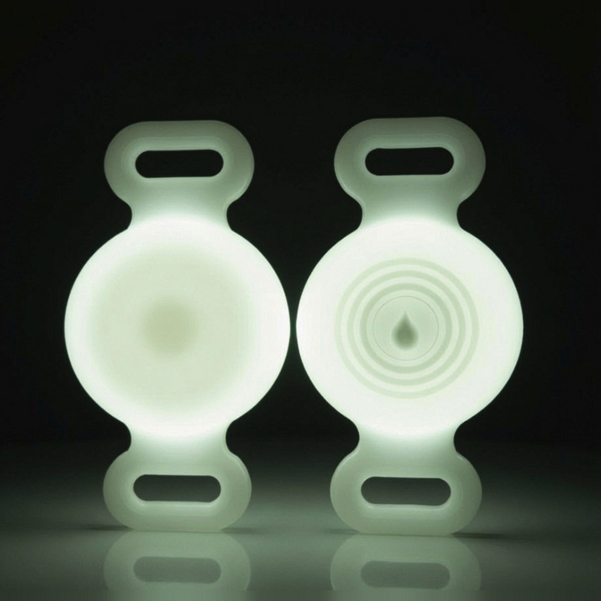 TailTrace dog collar tracker case — Glow White, front and back studio photo shown glowing in the dark