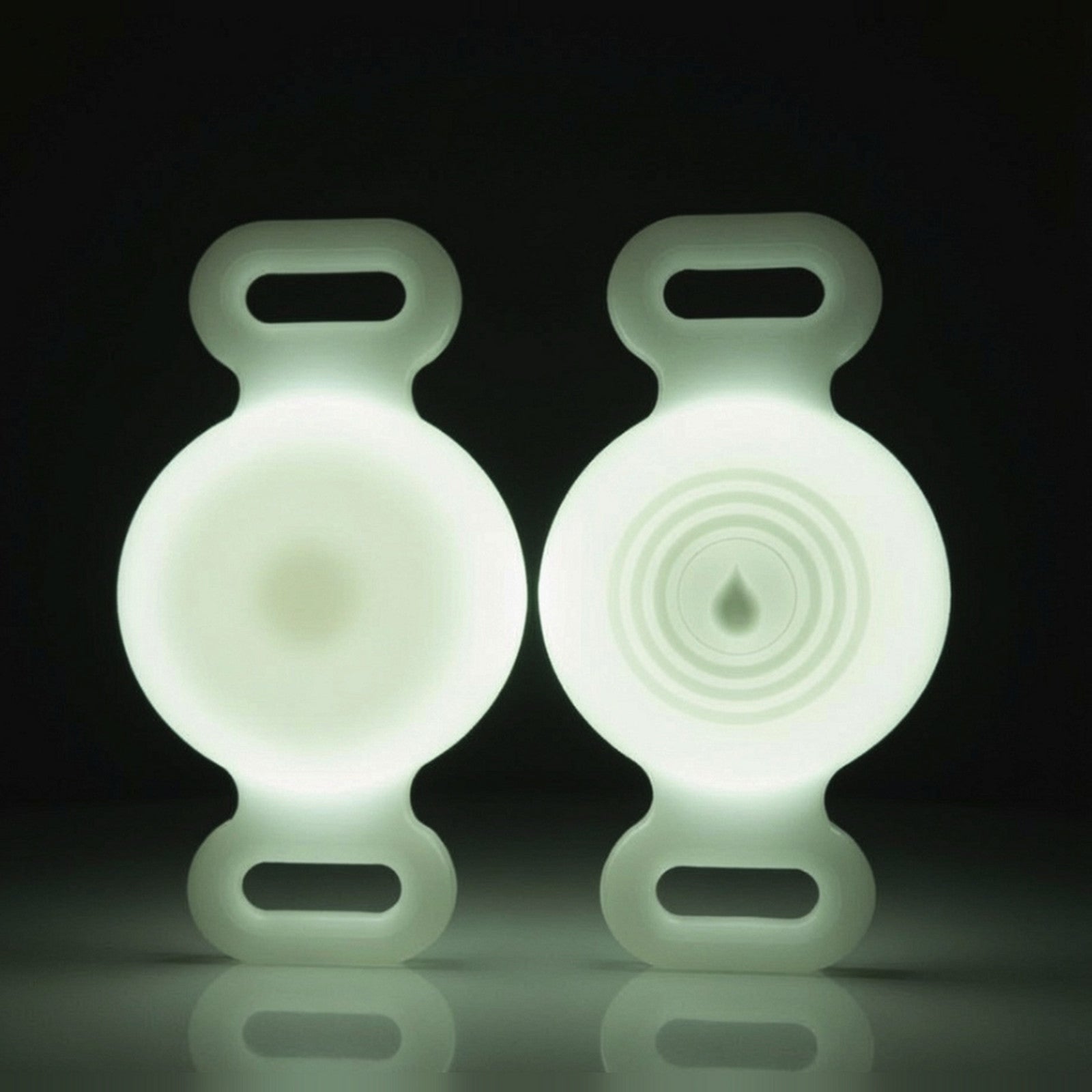 TailTrace dog collar tracker case — Glow White, front and back studio photo shown glowing in the dark