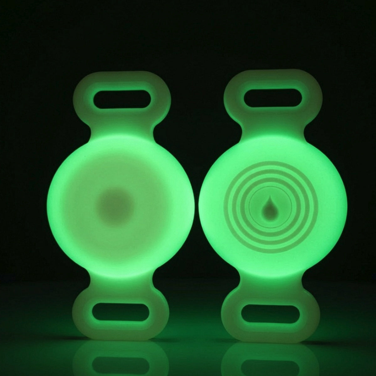 TailTrace dog collar tracker case — Glow in the Dark, front and back studio photo shown glowing in the dark