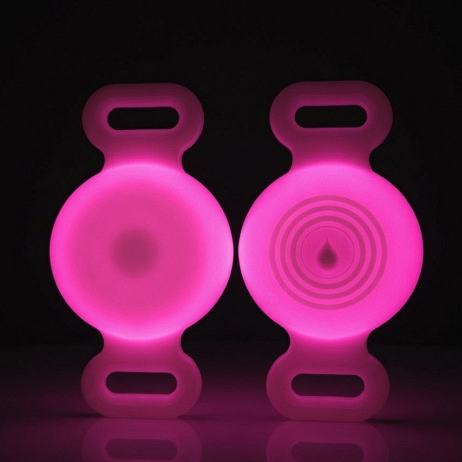 TailTrace dog collar tracker case — Hot Pink, front and back studio photo shown glowing in the dark